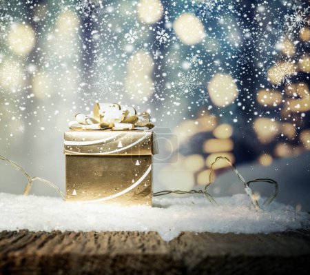 Photo for Golden gift box and holiday lights - Royalty Free Image