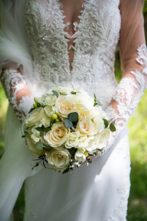 Photo for Bride holding beautiful weeding bouquet - Royalty Free Image