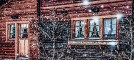 Photo for Traditional Swiss wooden hut and snowfall - Royalty Free Image