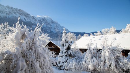 Photo for Wintertime in small german village covered with snow Garmish-Partenkirchen - Royalty Free Image
