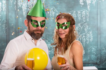 Photo for Cheerful couple celebrating New Year - Royalty Free Image