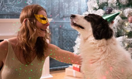 Photo for Happy white party dog celebrating New Year - Royalty Free Image