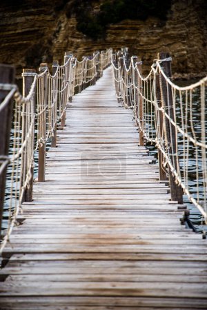 Photo for Wooden footbridge leading to the small island of Agios Sostis on Zakynthos, Greece, during a sunny summer day - Royalty Free Image