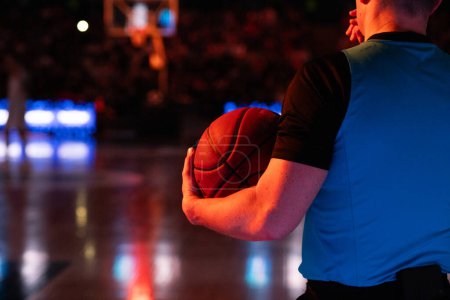 Photo for Referee holding basketball during game - Royalty Free Image