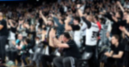 Photo for Blurred crowd of people at a sports event in arena - Royalty Free Image