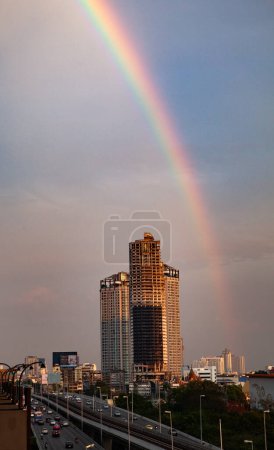 Photo for Rainbow over skyscrapers in Bangkok - Royalty Free Image