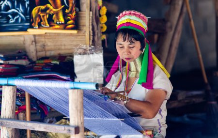 Photo for CHIANG MAI THAILAND- FEBRUARY, 2019 : Hill tribe Karen woman selling her goods in Baan Tong Luang eco village near Chiangmai,Thailand - Royalty Free Image