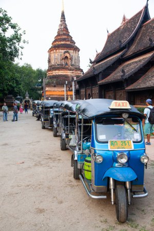 Photo for CHIANG MAI THAILAND- FEBRUARY 19, 2019 : Tuk tuk row waiting for passangers in front of Wat Lok Moli, Chiang Mai, Thailand in Chiangmai,Thailand - Royalty Free Image