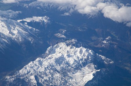 Photo for Aerial view of snow covered mountain peaks in the Alps - Royalty Free Image