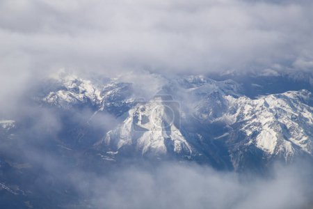 Photo for Aerial view of snow covered mountain peaks in the Alps - Royalty Free Image