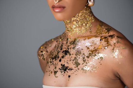 Photo for Cropped view of african american woman with foil on neck isolated on grey - Royalty Free Image