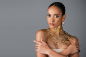 Pretty and stylish african american model with golden foil on neck isolated on grey  puzzle #620709290