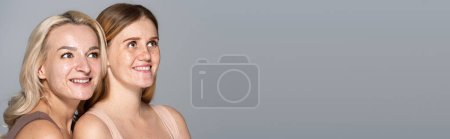 Photo for Carefree models with problem skin looking away isolated on grey, banner - Royalty Free Image