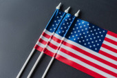 top view of American flags with stars and stripes for memorial day isolated on black  Poster #651838214