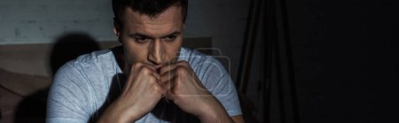 depressed man in white t-shirt suffering from post traumatic stress disorder, banner 