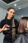 hairdo, positivity, hairdresser with braids cutting short brunette hair of woman, beauty worker, haircut, professional, beauty salon work, haircut, hairdressing cape, salon beauty tools, blurred  tote bag #660916856