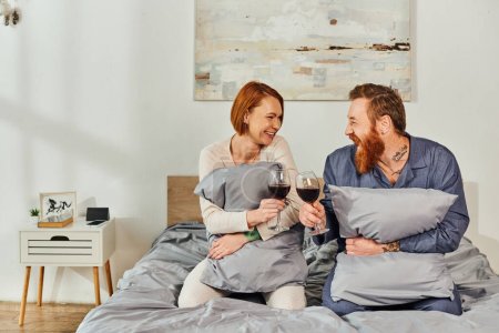 day off without kids, tattooed people, married couple holding glasses of red wine, redhead husband and wife, enjoying time, day off, weekends together, parents alone at home  magic mug #661667654