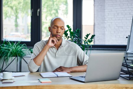 chronic illness, bold african american businessman with eye syndrome looking at laptop on desk, myasthenia gravis, dark skinned office worker, diversity and inclusion, entrepreneurship 