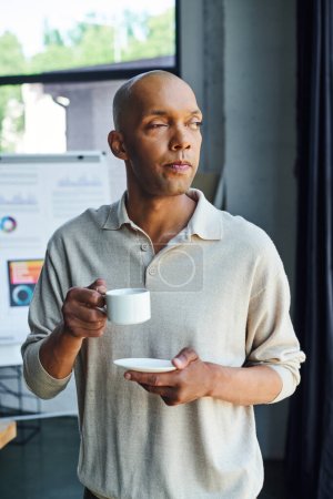chronic illness, inclusion, african american man with myasthenia gravis disease holding cup of coffee, bold and dark skinned office worker with ptosis syndrome having coffee break 