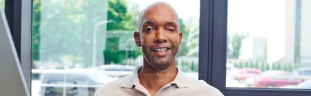 Photo for Inclusion, happy african american man with myasthenia gravis disease looking at camera, dark skinned office worker in casual attire having ptosis syndrome, professional headshots, banner - Royalty Free Image
