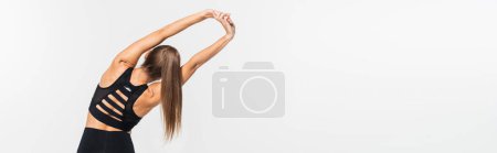 Photo for Back view of sportswoman warming up isolated on white, banner, healthy and fit concept, banner - Royalty Free Image