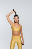 woman exercising with dumbbells, white background, workout, sportswoman, motivation  Longsleeve T-shirt #664864190
