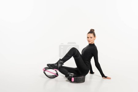 sportswoman in boots for jumping and active wear, kangoo jumping, active lifestyle, cardio