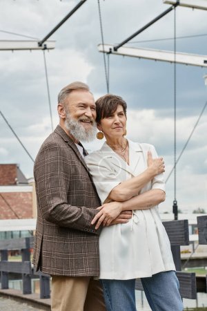 seniors and love, happy elderly couple hugging and standing together outdoors, bearded man, woman