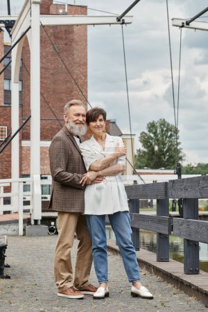 couple in love, happy elderly couple hugging, standing together outdoors, bearded man, woman, date