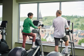 active seniors, positive woman looking at elderly man, exercising together, senior couple, sport Longsleeve T-shirt #669962152
