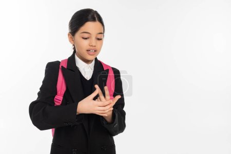 brunette schoolgirl counting on fingers isolated on white, student in uniform, education, smart
