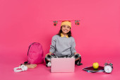 smile, girl in beanie hat sitting with penny board on head, laptop, headphones, apple,  alarm clock hoodie #670363000