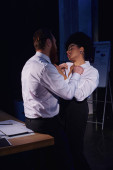 businessman undressing hot and charming african american woman in eyeglasses in office, work romance t-shirt #670962830