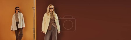 Photo for Fall fashion, multiethnic women in sunglasses and outerwear posing on colorful backdrop, banner - Royalty Free Image