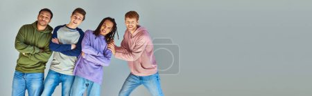 Photo for Jolly young men in everyday urban clothing smiling sincerely at camera, cultural diversity, banner - Royalty Free Image