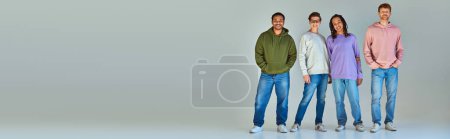 Photo for Four young multicultural men in street wear looking and smiling at camera, diversity, banner - Royalty Free Image