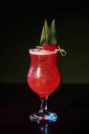 Photo for Esthetic singapore sling cocktail with fresh raspberries on black background, concept - Royalty Free Image