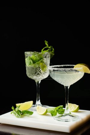 delicious bohemian rhapsody and margarita with decorations on black backdrop, concept