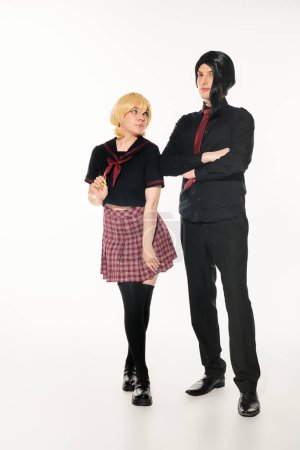woman in blonde wig looking at man in black clothes with folded arms on white, anime style students