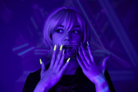 amazed blonde woman with fluorescent manicure in blue neon light on abstract backdrop, anime style