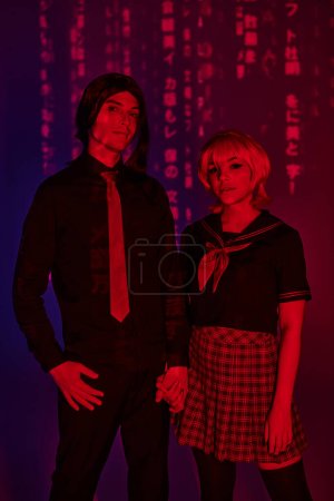 anime style students in uniform holding hands in red neon light on abstract purple backdrop
