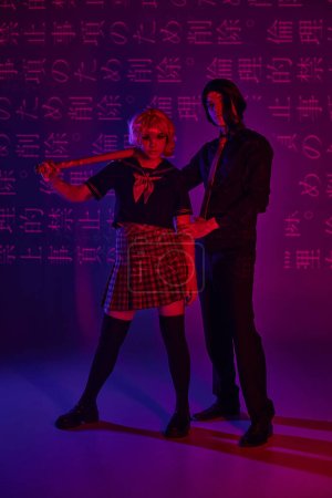 anime woman with baseball bat near man in wig on neon purple backdrop with hieroglyphs projection