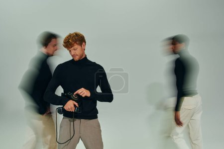 Photo for Red haired man with retro phone with motion blur of other male models, long exposure, men power - Royalty Free Image
