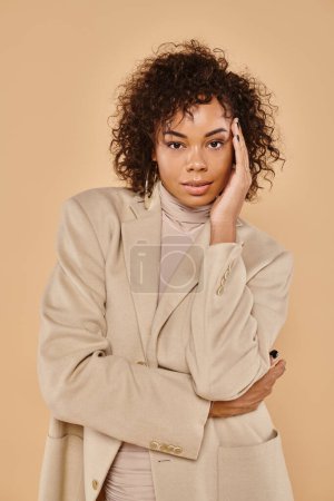 Photo for Autumn fashion, stylish african american woman posing in turtleneck and blazer on beige backdrop - Royalty Free Image