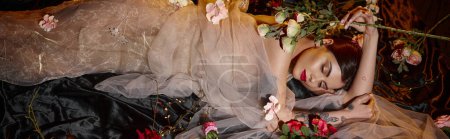 attractive sensual young woman in romantic transparent dress lying among blooming flowers, banner
