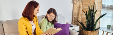 smiling woman reading book about sex education to teenage daughter  in living room, banner