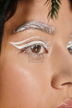 beauty, close up of pretty woman with winter eye makeup looking away, white eyebrows and eyeliner