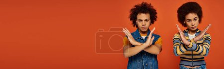 Photo for Young african american brother and sister showing denial gesture looking at camera, family, banner - Royalty Free Image