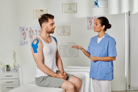 Photo for Good looking bearded patient and attractive young doctor looking at each other attentively - Royalty Free Image