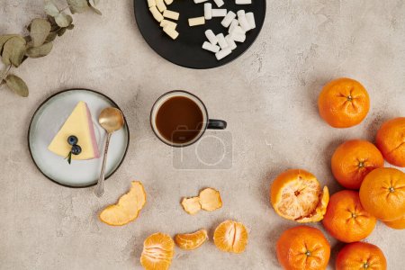 Photo for Christmas background, hot chocolate and marshmallows near pudding and tangerines on grey surface - Royalty Free Image